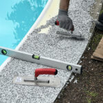 ©Terramore-Bodendesign_IMG_1299 Pool mit Steinteppich Umrandung